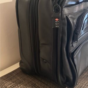 Tumi Leather Wheeled over night/computer bag.